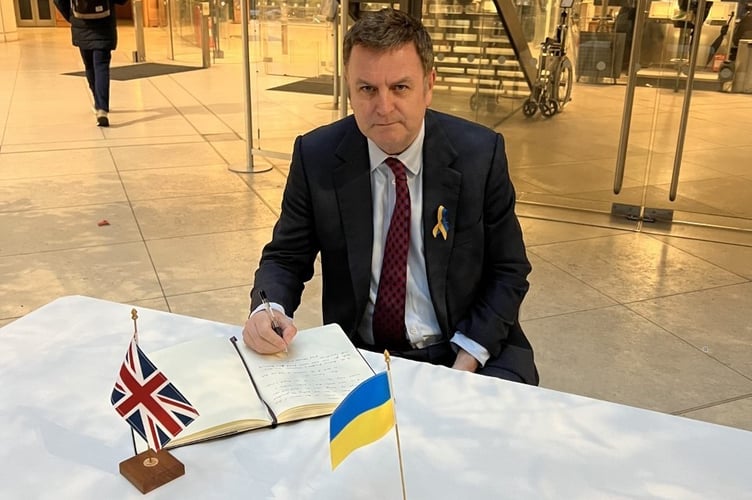Mel Stride signing the book of solidarity for Ukraine in the House of Commons in March 2022.