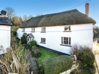 Former farmhouse for sale has 1500s origins and "charming" features 