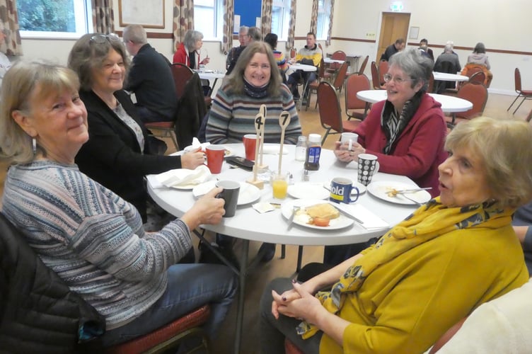 A group of ladies enjoying their meal and 'catching up' at the Big Breakfast at Cheriton Fitzpaine.