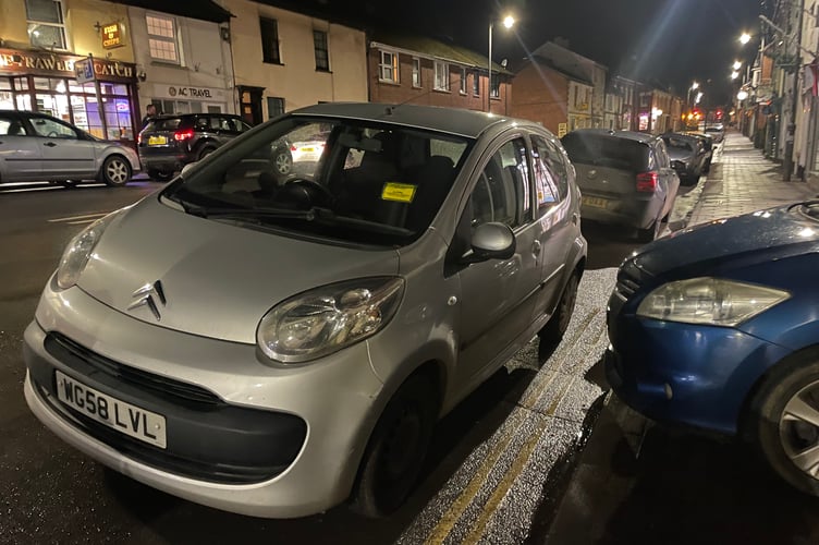 The car with the parking ticket. AQ 4226