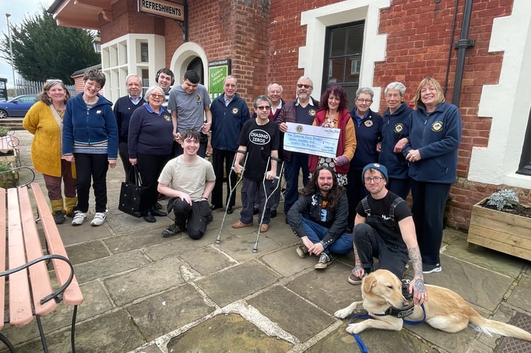 Lions Club of Crediton members presenting the cheque to representatives from The Turning Tides Project.  AQ 4626
