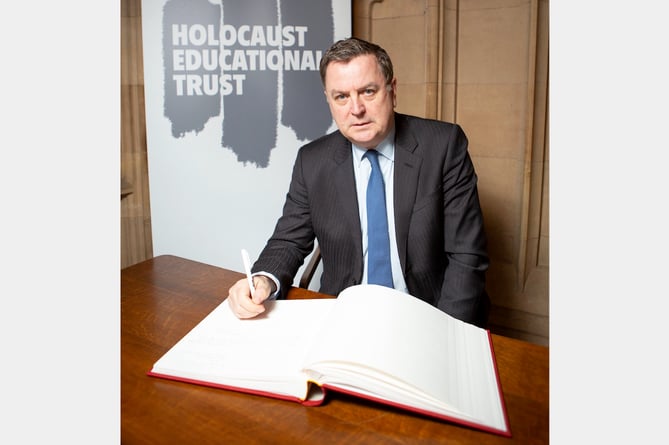 Mel Stride, MP for Central Devon, signing the Holocaust Educational Trust’s Book of Commitment in the House of Commons.
