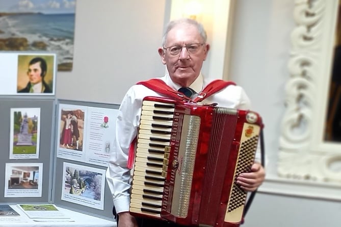 An image of 78 year-old accordion player, Stuart Douglas.
