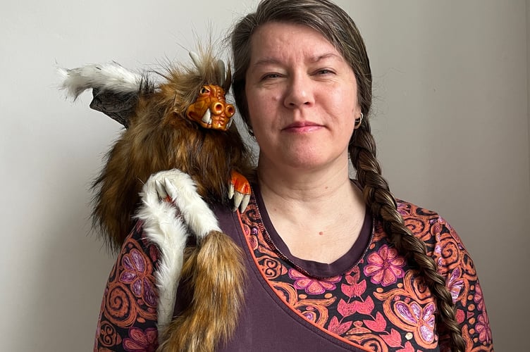 Author Tracey Norman with her dragon puppet.