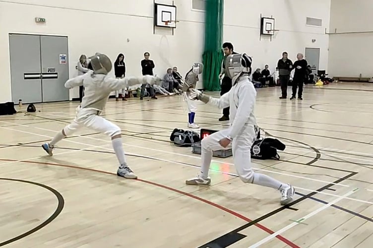 Sabre fencers in action.
