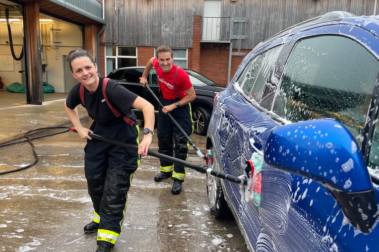 Firefighters busy at the car wash.  AQ 4890