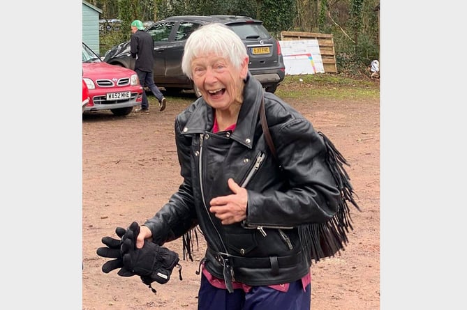 Pat in her leather jacket after dismounting from the motorbike at Sandford Cricket Club.
