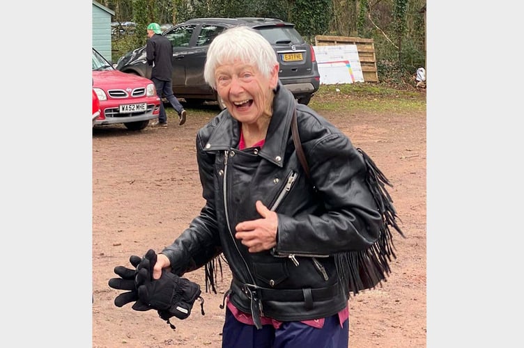 Pat in her leather jacket after dismounting from the motorbike at Sandford Cricket Club.