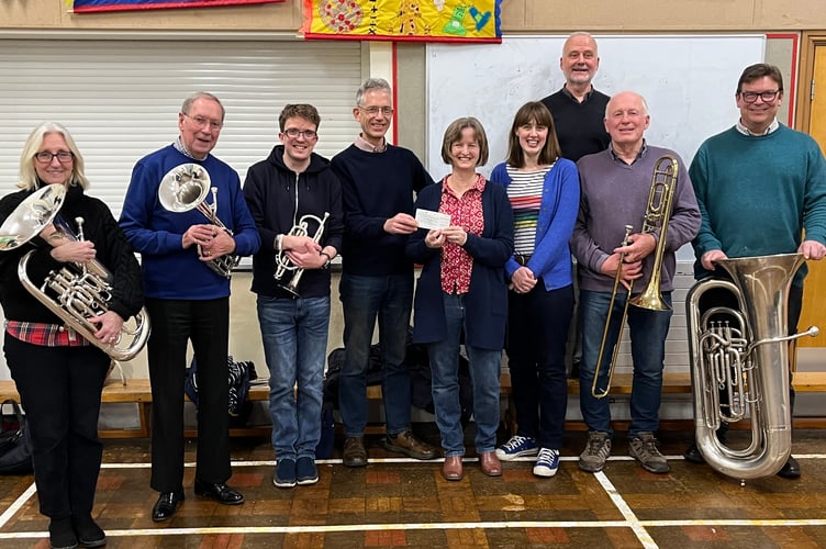 Band chairman James Hatchell, presented the cheque to Fiona Cochran, Crediton Foodbank Co-ordinator. 
