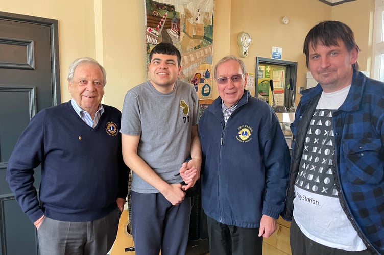 Otis, second left, with Crediton Talking News readers Peter Bryan, left, and Eric Parkes, third left, with right, Tom Burns, TTTP Podcast producer. AQ 4634