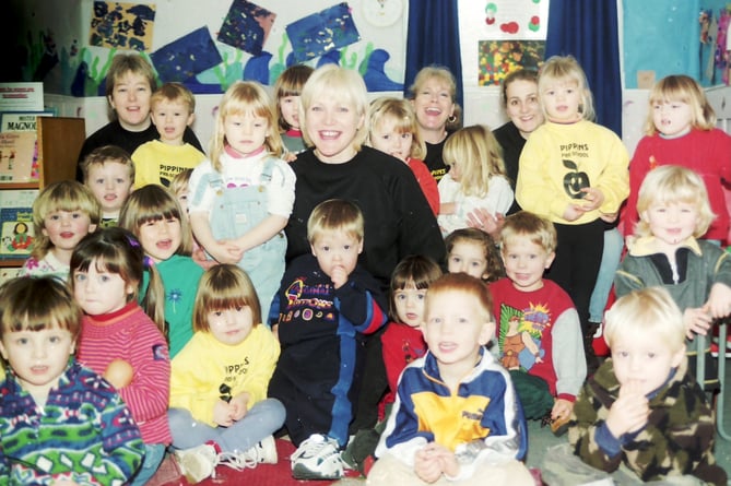 Pictured in February 1999 is Judy Blackaller, supervisor at Pippins Pre-School in Crediton, who was to run in the London Marathon, with some of the children from the pre-school. DSC00327
