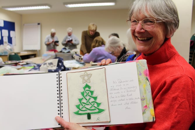 Ann with the Celtic knot Christmas tree she had embroidered worked in satin, back, chain and whip stitches.  SR 9452
