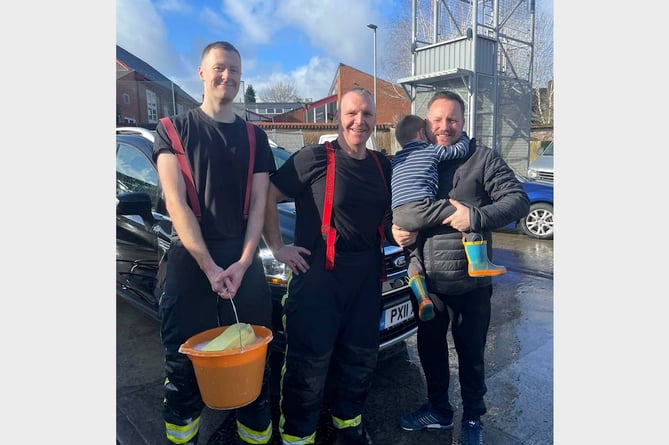 Crediton Fire Co-Responders Rory and Mark pictured with Thomas and his father Alan at the car wash on Sunday, February 11.
