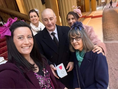 Dennis and his family after he received his MBE.
