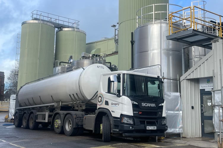 A tanker in front of a part of the Crediton Dairy factory.  AQ 5486