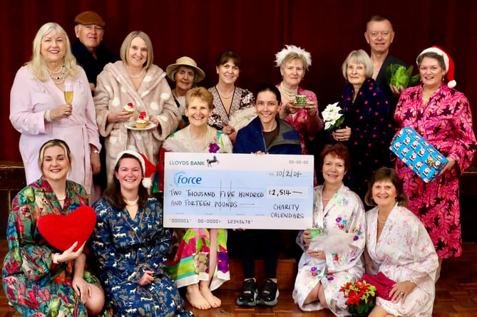 Emma Healey, centre left, presenting the cheque to Ceri Bastian of FORCE Cancer Charity, centre right, with some of those who feature in the 2024 calendar.
