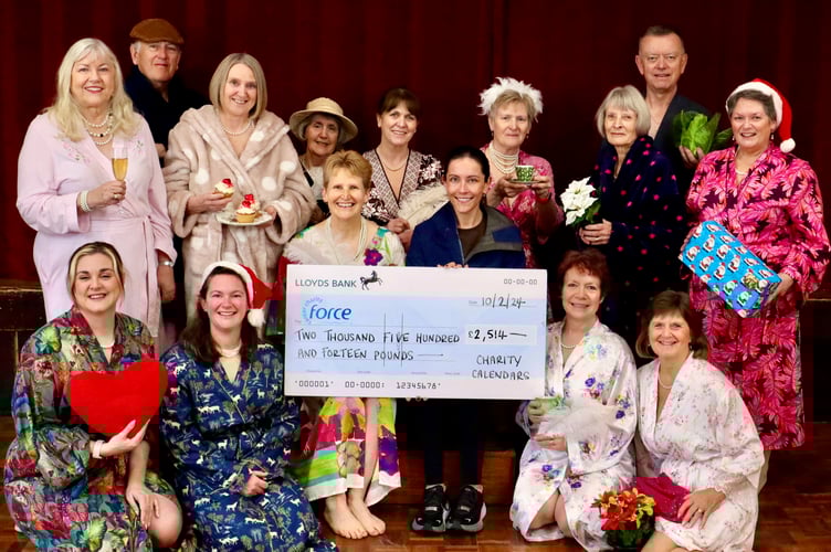Emma Healey, centre left, presenting the cheque to Ceri Bastian of FORCE Cancer Charity, centre right, with some of those who feature in the 2024 calendar.