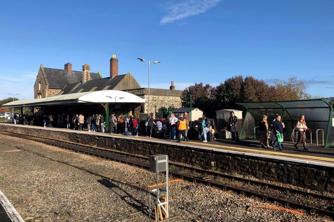 A crowd waiting for a train at Barnstaple Railway Station in January 2024.
