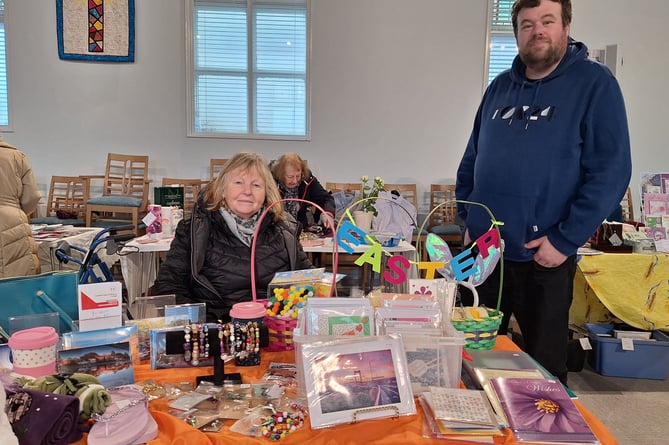 Alison and Lawrie Richardson on their stall at the Table Top Sale at Crediton Methodist Church.
