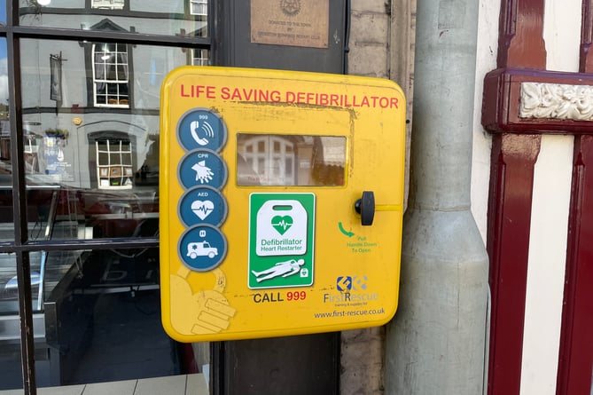 The box for the missing defibrillator outside Cox’s Butchers.  AQ 7218
