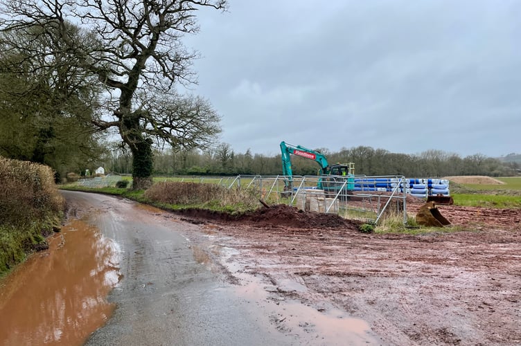 One of the entrances to the Bellway homes site at Pedlarspool/Creedy Corner, with the water pipes already on site.
