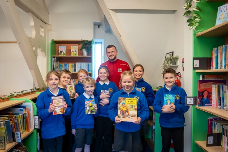 Exeter City Football Club Captain Pierce Sweeney opened Morchard Bishop C of E Primary School Library.