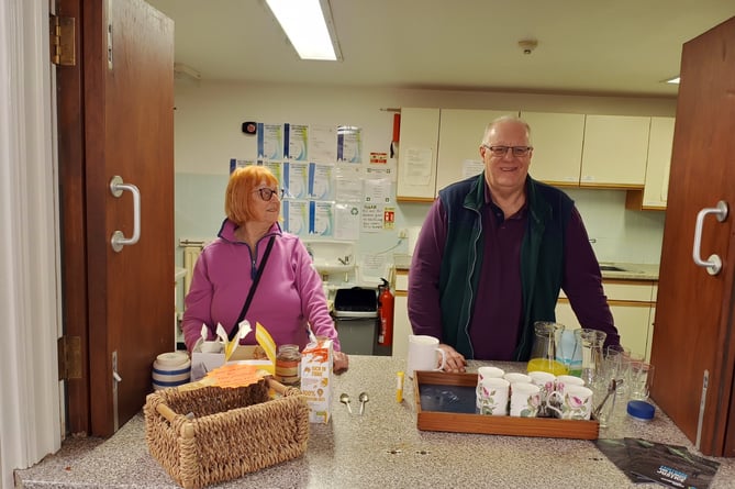 Sue Huxham and Nick Townsend serving Fair Trade tea and coffee at the Copplestone Fair Share Coffee Morning.
