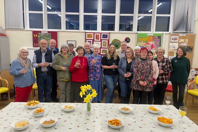 Chelsea Yelland, centre right, with Jenny Berg, chair, centre and some of the volunteers and staff at a Crediton Age Concern social event.  AQ 8304
