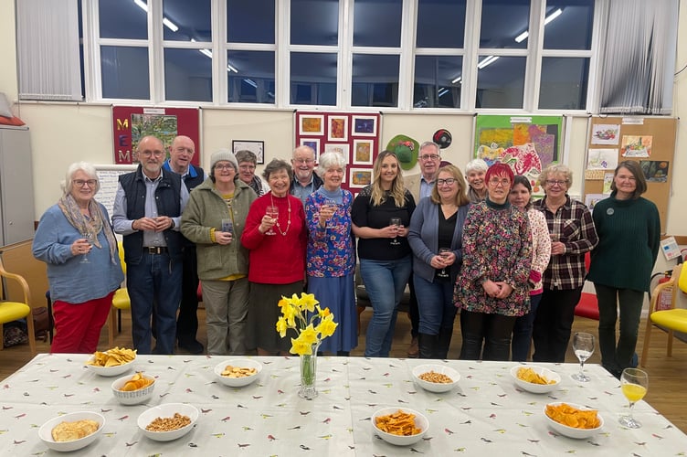Chelsea Yelland, centre right, with Jenny Berg, chair, centre and some of the volunteers and staff at a Crediton Age Concern social event.  AQ 8304