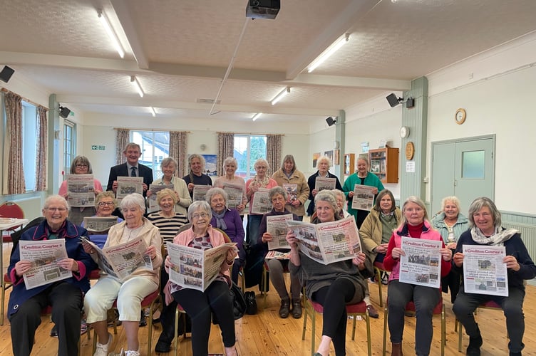 ‘Crediton Courier’ Editor Alan Quick, back left, with some of the members of Morchard Bishop WI following his talk about the newspaper.  AQ 7710