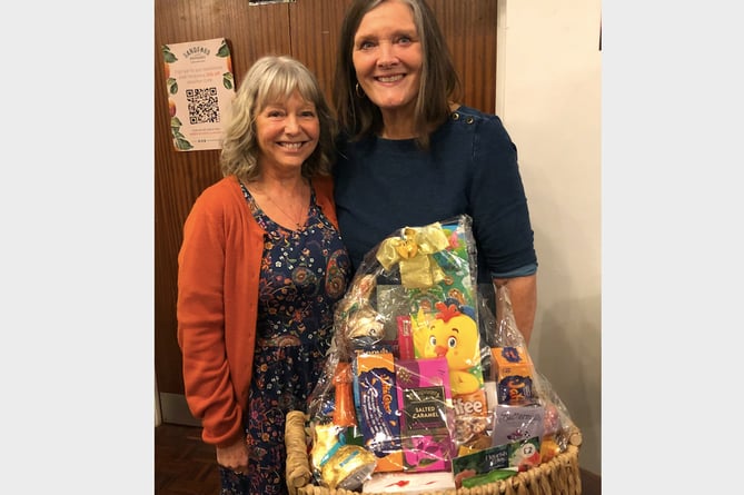 Winner of the Easter Hamper was Jude Thistlewood, left, who was presented with it by Crediton Friends of FORCE chairperson Di Pring.
