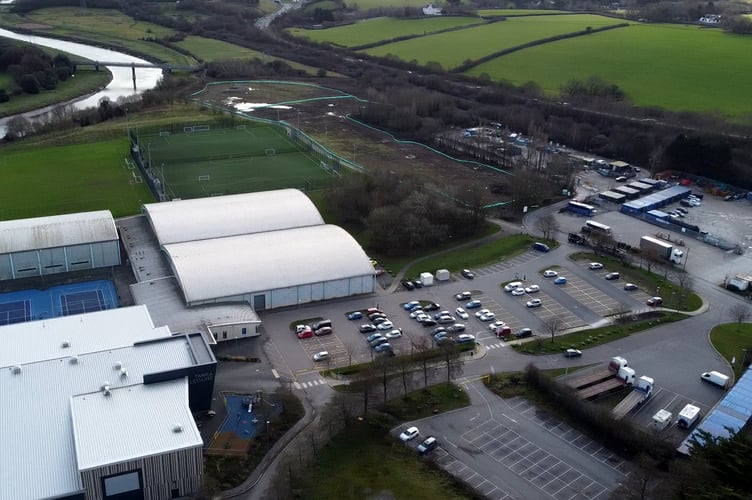 The car park site fenced at the top of the image.
