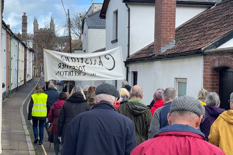 The Walk of Witness heads towards Crediton Parish Church. AQ 9003