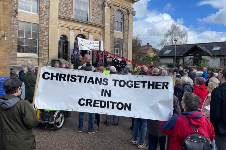 During worship at Crediton Congregational Church. AQ 9132