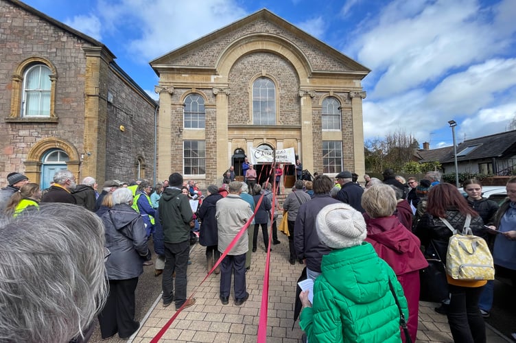 Red ribbons during worship at Crediton Congregational Church. AQ 9124