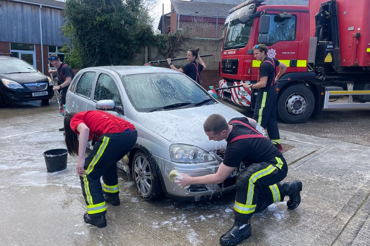 Hard at work at Crediton Fire Station.  AQ 9207
