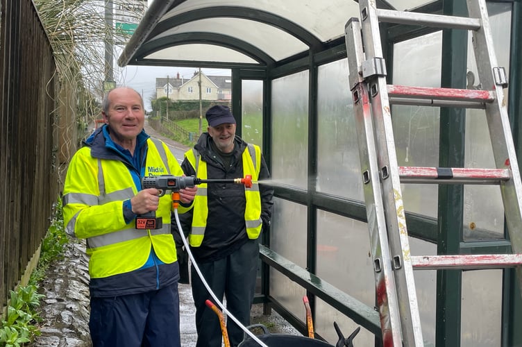 Pressure washing the bus shelter was a task.  AQ 7992
