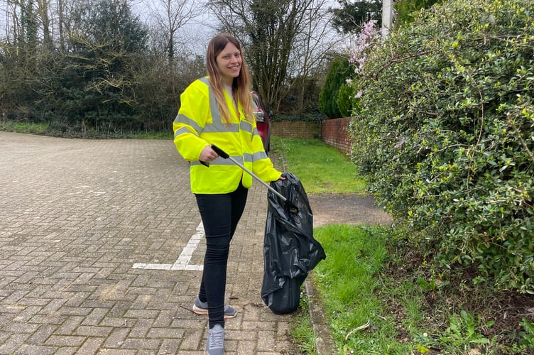 Happy about picking up litter, one of the volunteers.  AQ 7956
