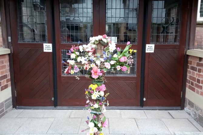 The cross with flowers for Easter at Crediton Methodist Church.  Photo: Hilary Everett
