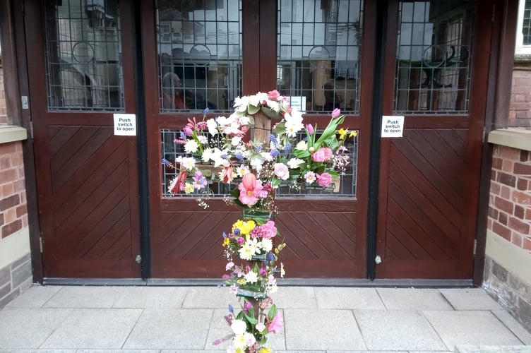 The cross with flowers for Easter at Crediton Methodist Church. Photo: Hilary Everett