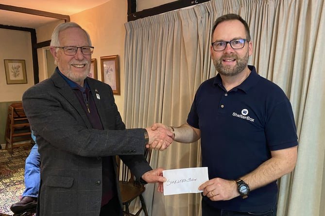 Fred Oliver, the Vice President of Crediton Boniface Rotary Club, left, presenting £3,500 to John Cleverley, representing ShelterBox.
