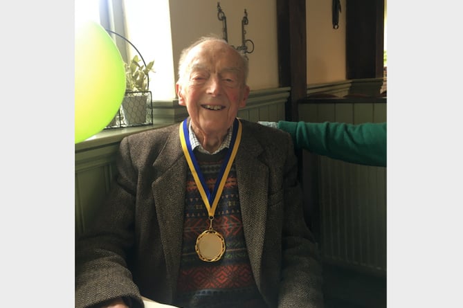 John Allen with his 105th birthday medal.
