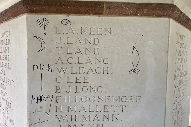 Some of the graffiti discovered on Crediton War Memorial. AQ 9947
