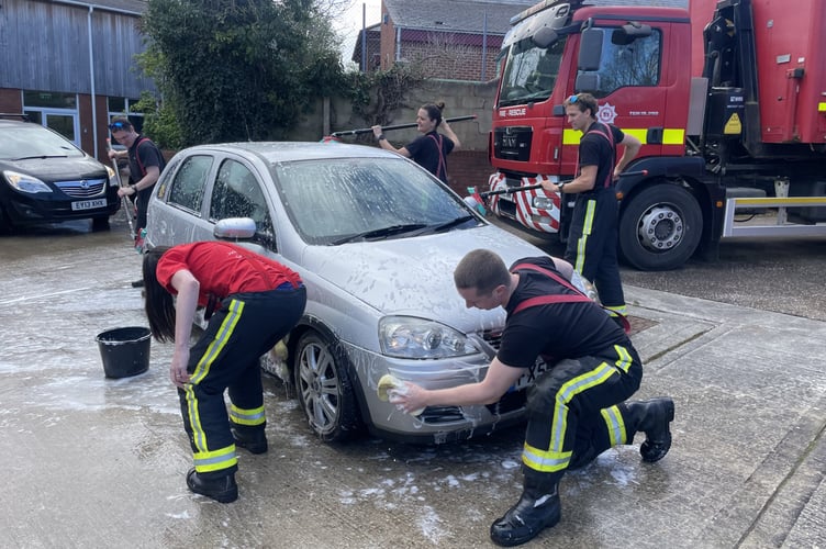 All hands to the pump to clean another car at Crediton Fire Station. AQ 9207