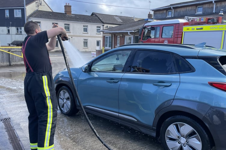 Finishing touches made to clean another car at the Fire Station car wash. AQ 9203