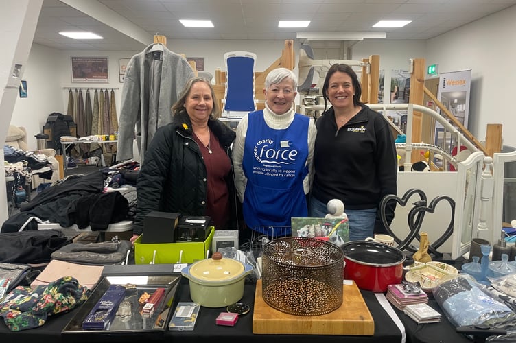Helpers behind one of the stalls at the Table Top Sale held at Dolphin Stairlifts Showrooms in aid of FORCE. AQ 8572