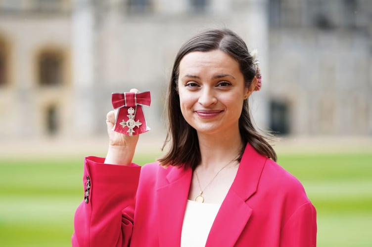 Laura Coryton with her MBE. Image: BCA Film