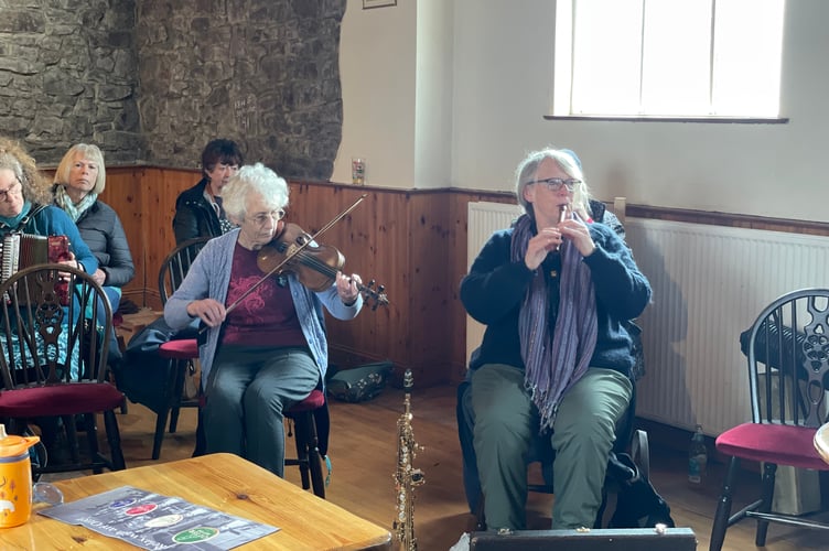 Musicians during a music and song session.  AQ 8704