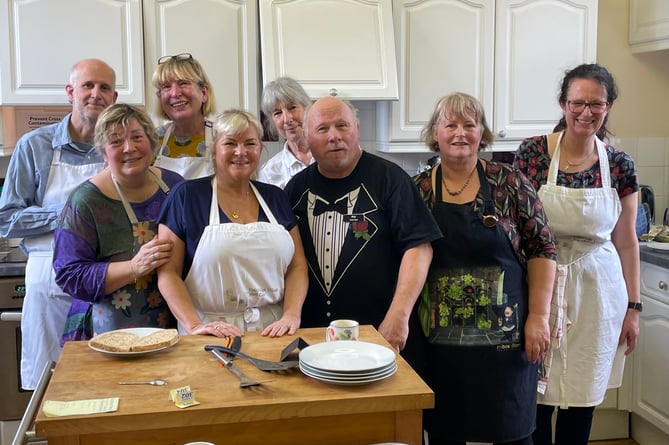 Kate Fitch, fourth left, with helpers who served 93 breakfasts in aid of FORCE at Coldridge.  AQ 8012
