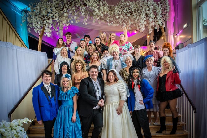 The cast of CODS musical ‘The Wedding Singer’ pose for a picture.  Image: Mike Palmer.
